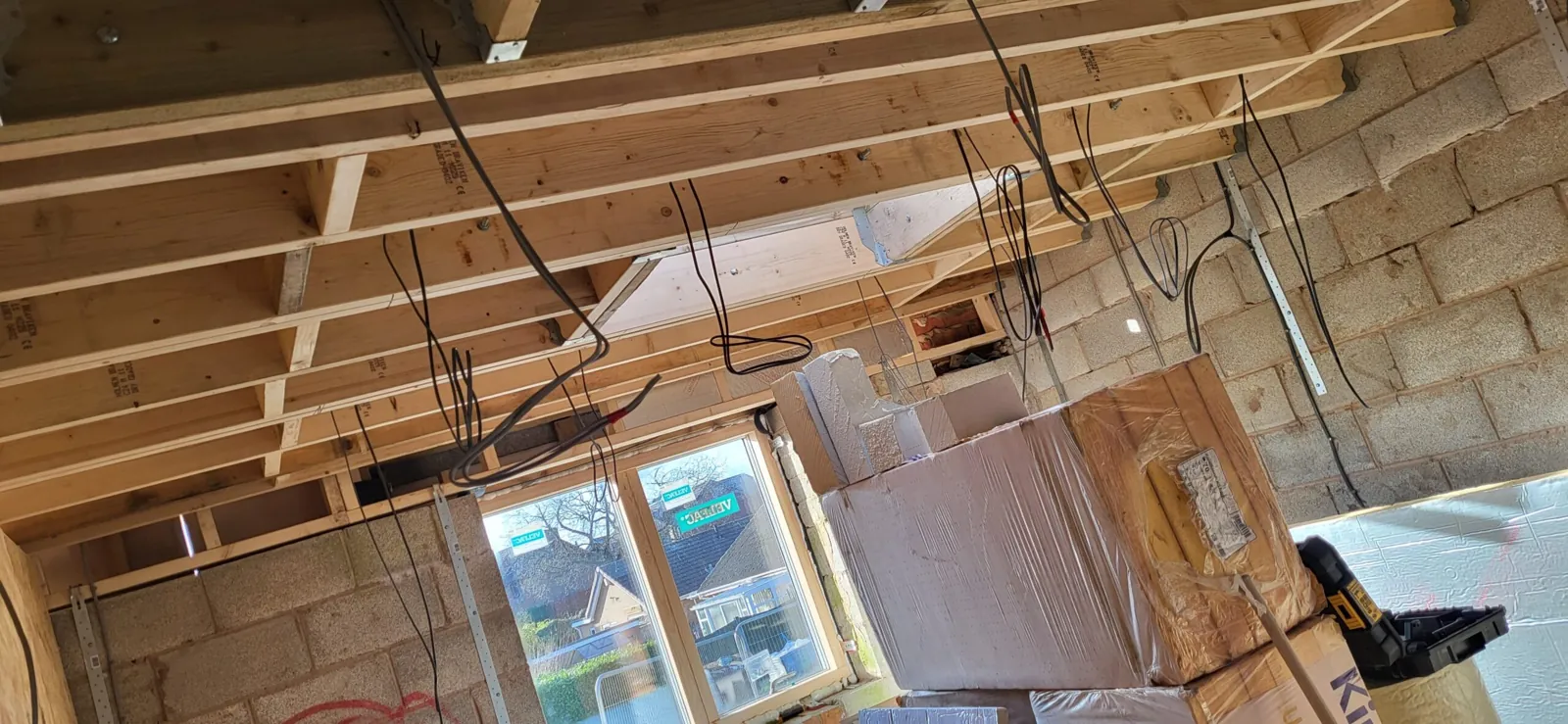 First fix rewire cabling neatly clipped through joists in a Cheshire home extension