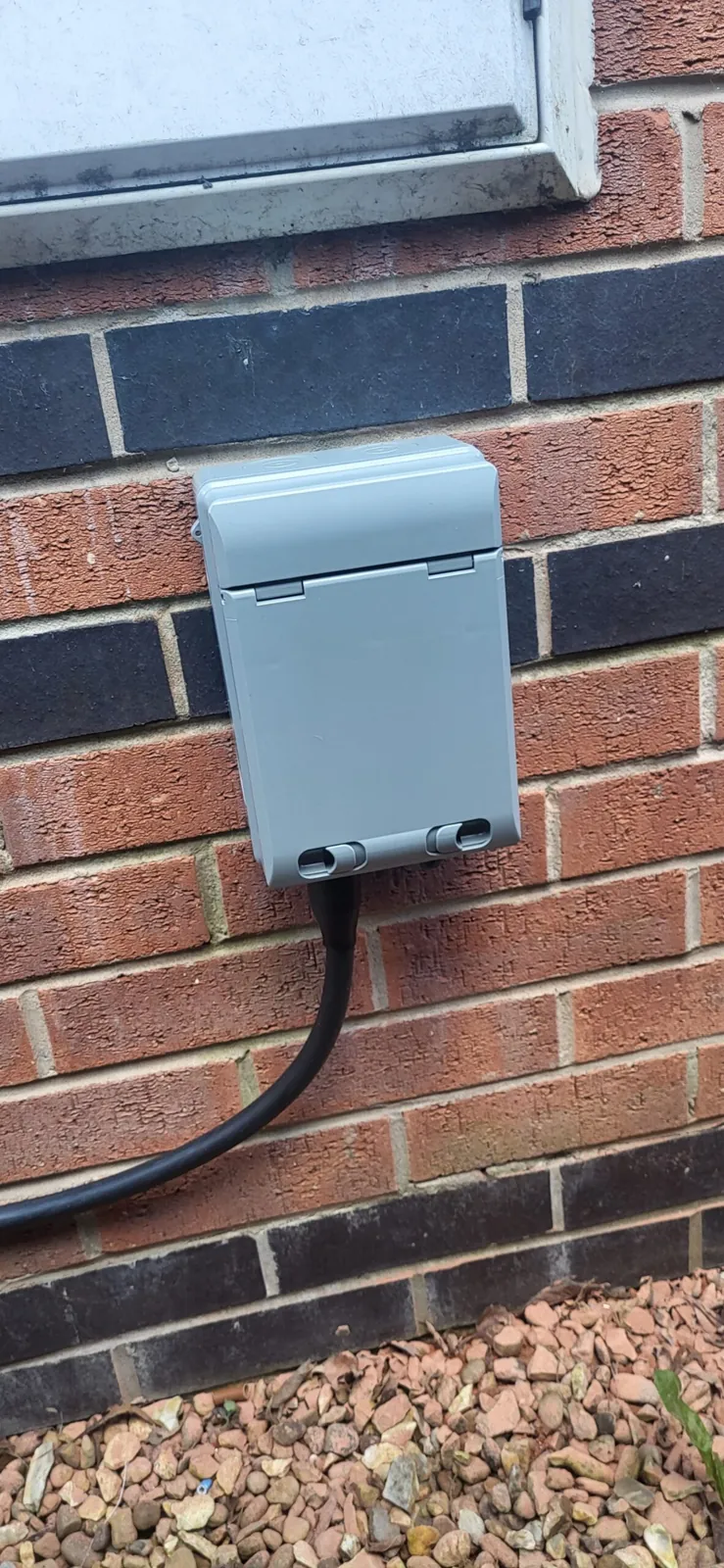External isolator enclosure neatly installed on a brick wall
