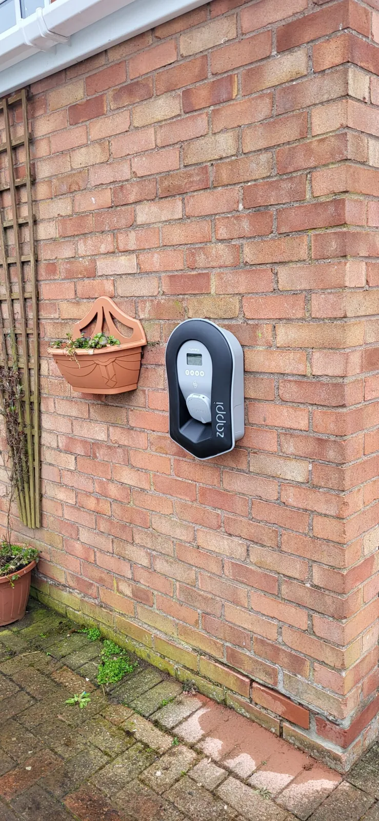 Ohme EV charger installed on a garden wall of a Cheshire property